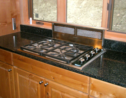 Wolf cooktop and downdraft exhaust